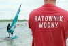 Water rescue lifeguard watching over Pogoria III lake during a summer watersports day in Poland.